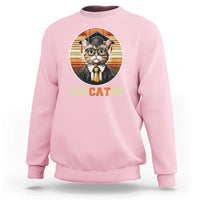 Light pink cat graduation sweatshirt with 'Educated' graduation hat graphic.