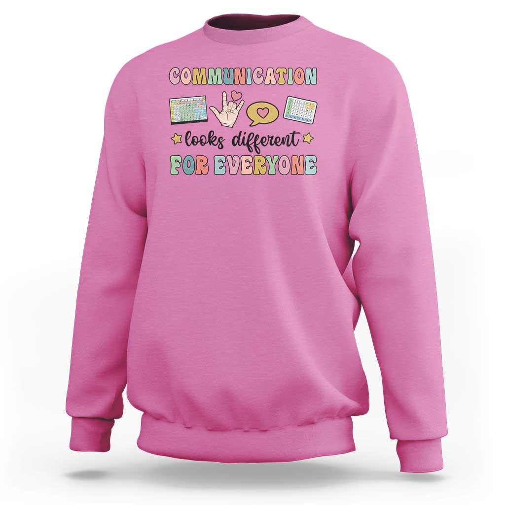 Azalea pink crewneck graphic sweatshirt with colorful “Communication for everyone” text design