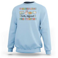 Light blue crewneck graphic sweatshirt with colorful “Communication for everyone” text design