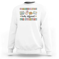White crewneck graphic sweatshirt with colorful “Communication for everyone” text design