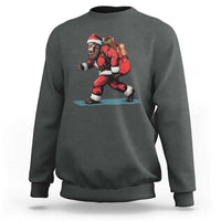 Dark heather gray crewneck sweatshirt with red Santa-style bigfoot graphic on the front
