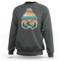 Ski-themed crewneck sweatshirt in charcoal gray with retro mountain goggles graphic