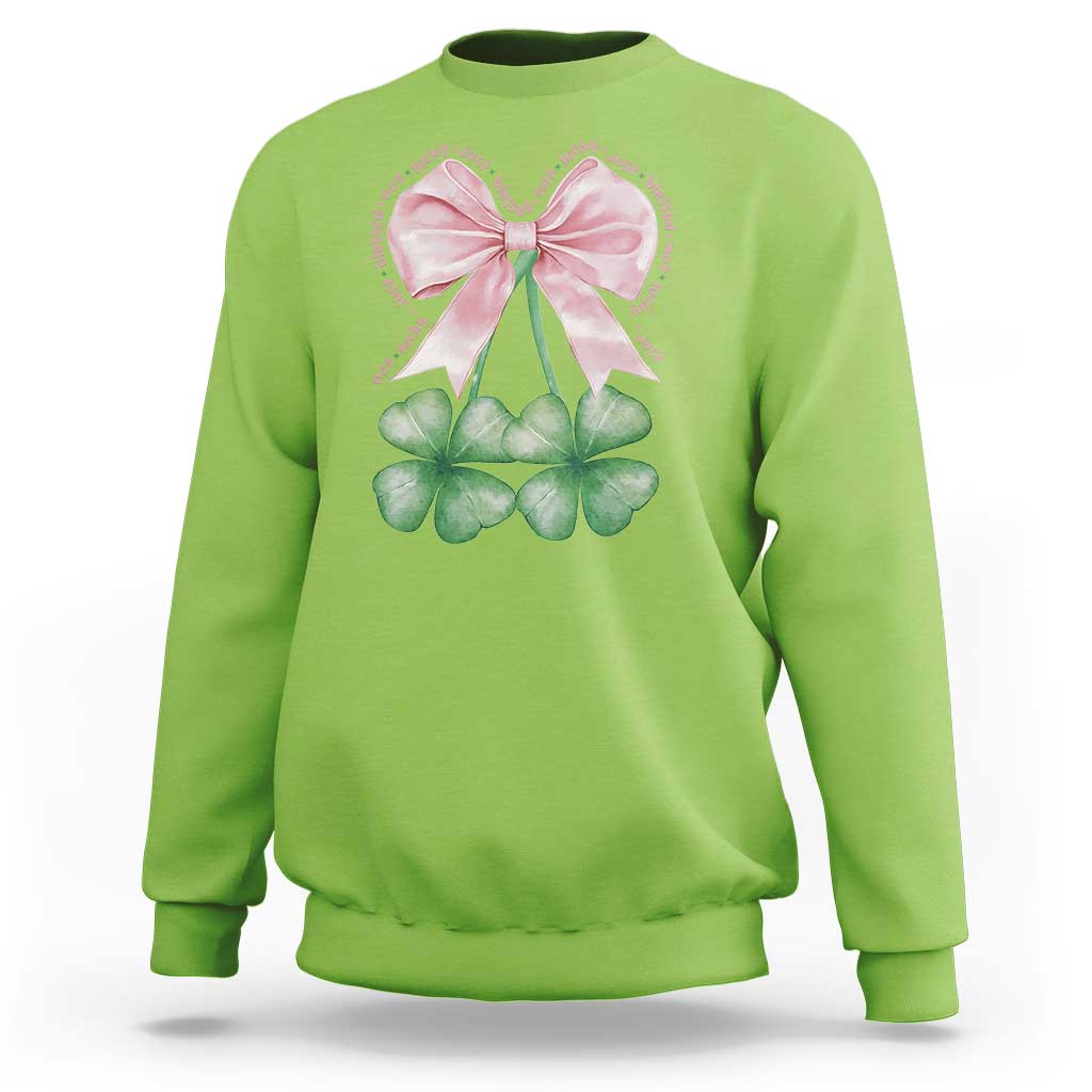 Lime green sweatshirt with pink bow and four-leaf clover shamrock graphic on front