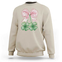 Beige sweatshirt with pink bow and four-leaf clover shamrock graphic on front
