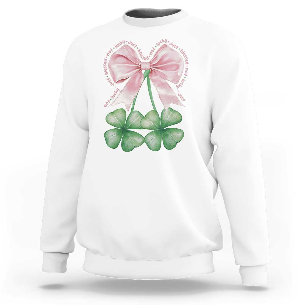 White sweatshirt with pink bow and four-leaf clover shamrock graphic on front