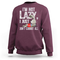 Maroon crewneck sweatshirt with bunny carrot joke graphic on front