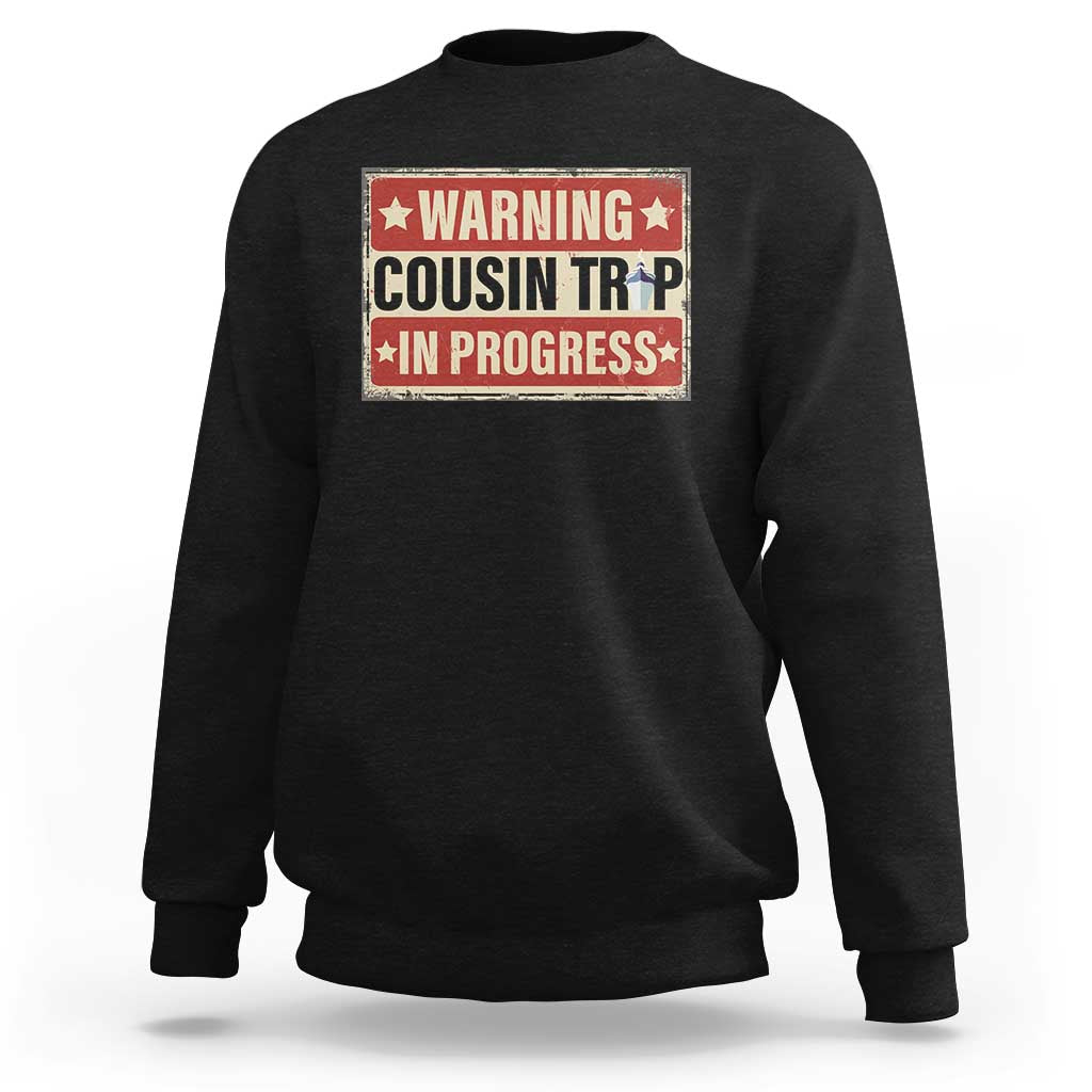 Black crewneck sweatshirt with warning-style 'COUSIN TR' graphic patch