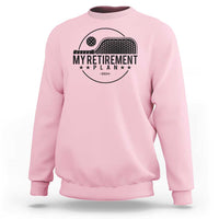 Light pink crewneck sweatshirt with pickleball paddle graphic and 'Retirement Plan 2024' text