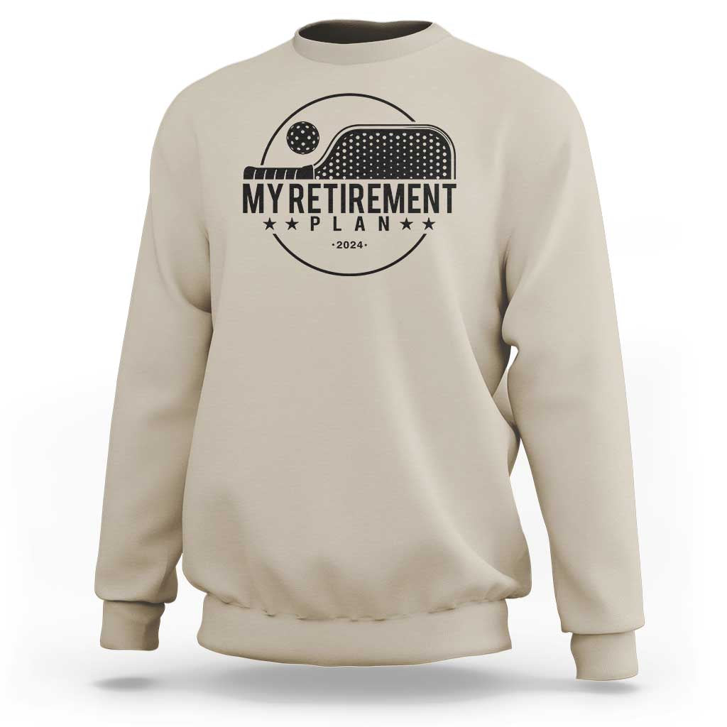 Sand crewneck sweatshirt with pickleball paddle graphic and 'Retirement Plan 2024' text