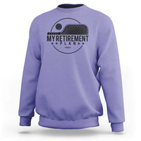 Violet crewneck sweatshirt with pickleball paddle graphic and 'Retirement Plan 2024' text