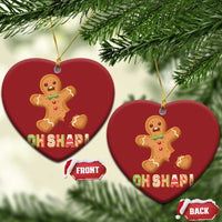Heart-shaped gingerbread Christmas ornament with gold string and red "OH SHAPI!" design