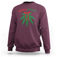 Maroon crewneck sweatshirt with “MISTLESTONED” text and mistletoe leaves graphic