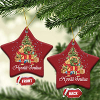 Red star Christmas ornament with Hyvää Joulua print, shown front and back