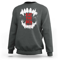 Dark heather sweatshirt with white fang graphic and red “EAT THE RICH” text on back
