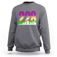 Charcoal gray crewneck sweatshirt with 228 colorful graphic and green skyline print