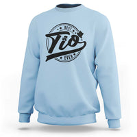 Light blue crewneck sweatshirt with 'Tio' graphic print on chest, long sleeves