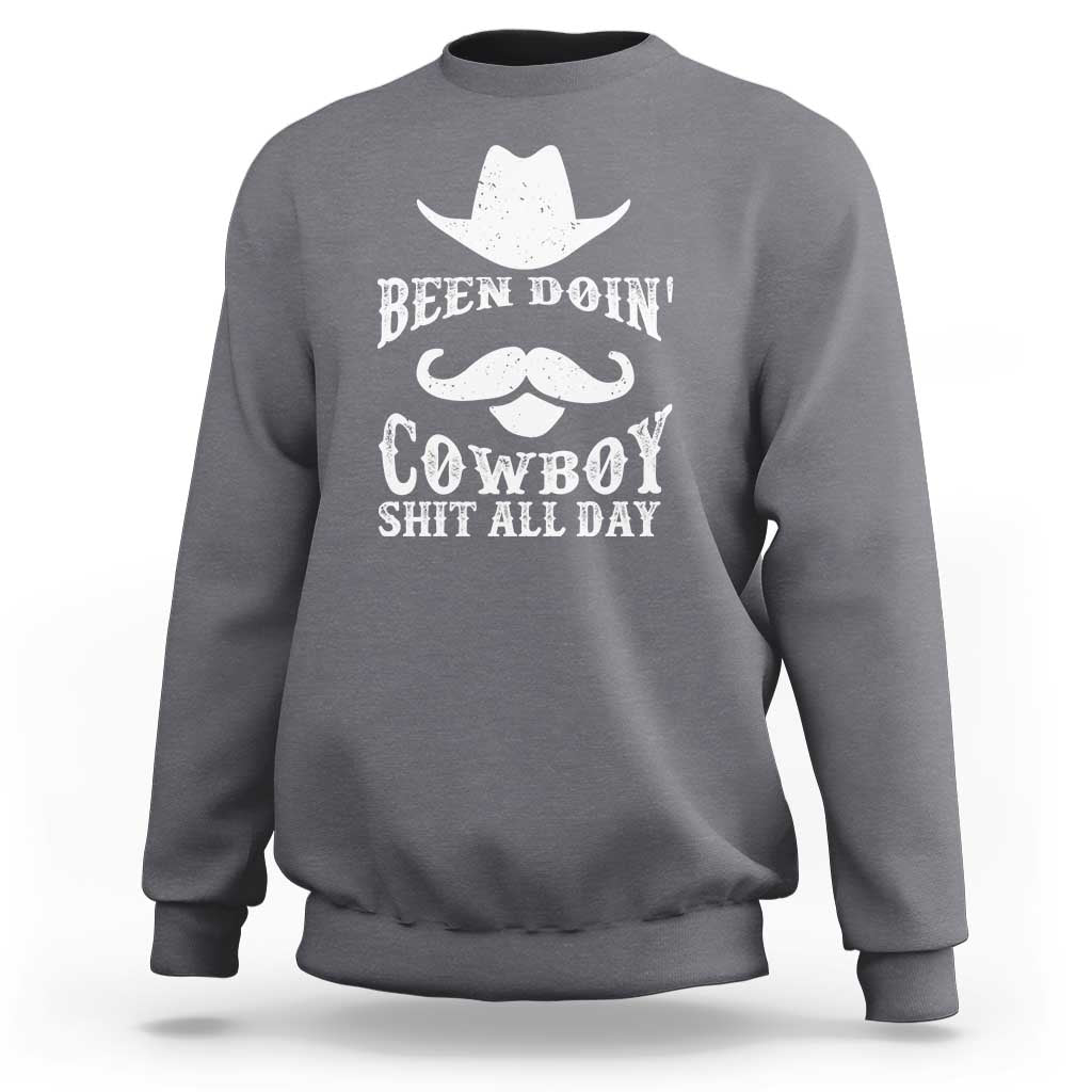 Charcoal gray cowboy sweatshirt with white graphic: Been Doin' Cowboy Shit All Day