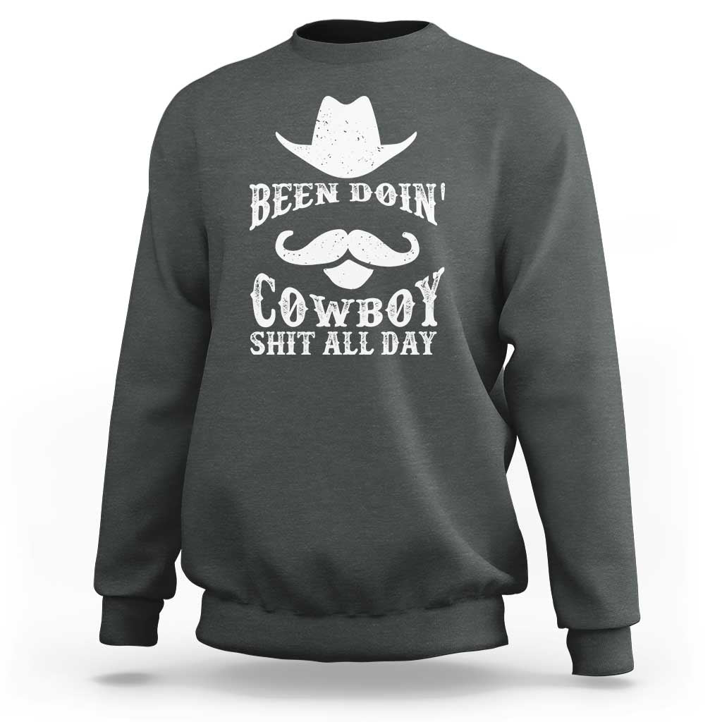 Dark gray-green cowboy sweatshirt with white graphic: Been Doin' Cowboy Shit All Day
