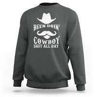 Dark gray-green cowboy sweatshirt with white graphic: Been Doin' Cowboy Shit All Day