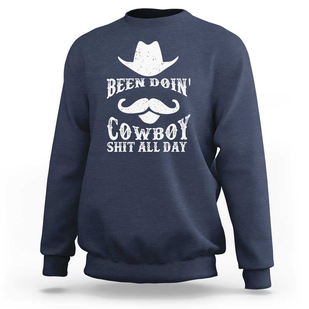 Navy cowboy sweatshirt with white graphic: Been Doin' Cowboy Shit All Day