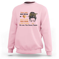 Light pink sweatshirt with front graphic of tattoo heart, woman face, and text