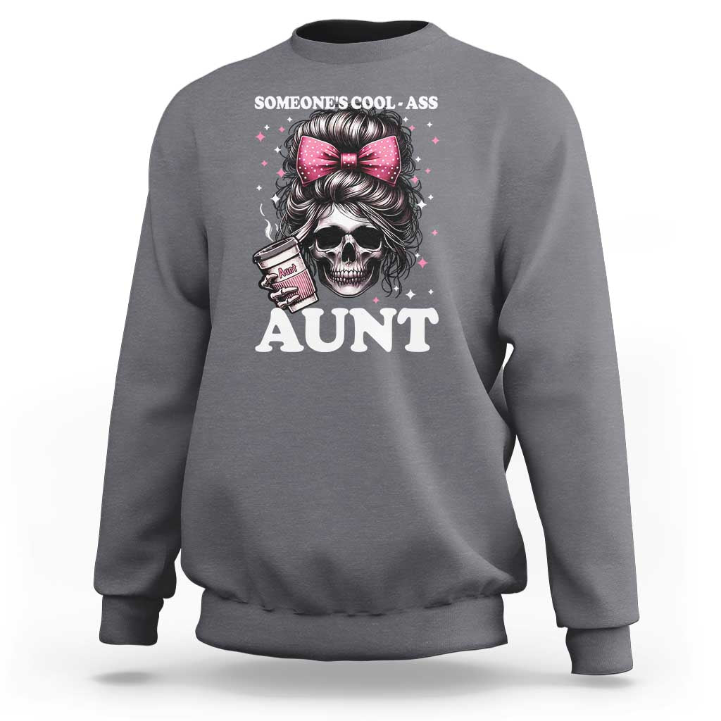 Charcoal crewneck sweatshirt with skull and pink bow graphic reading “AUNT”