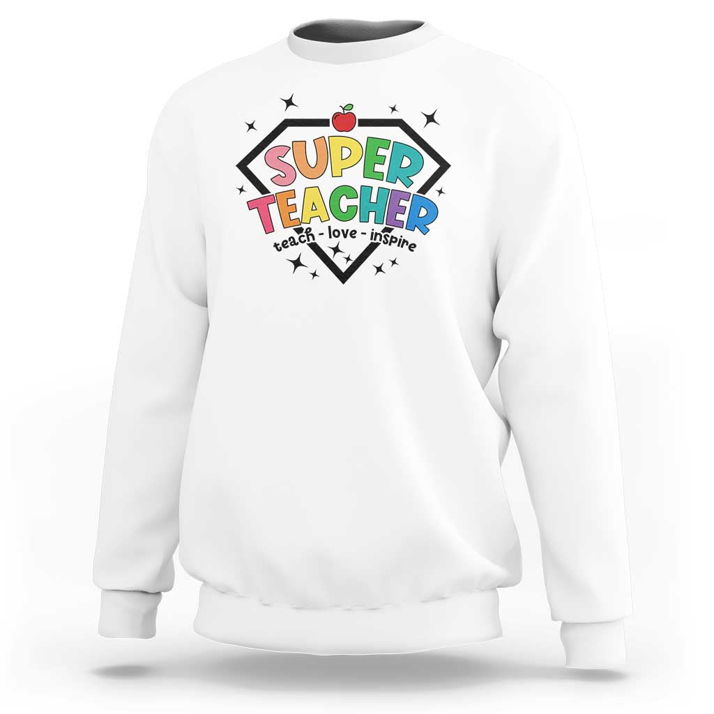 White sweatshirt with “SUPER TEACHER” graphic and apple emblem on the front