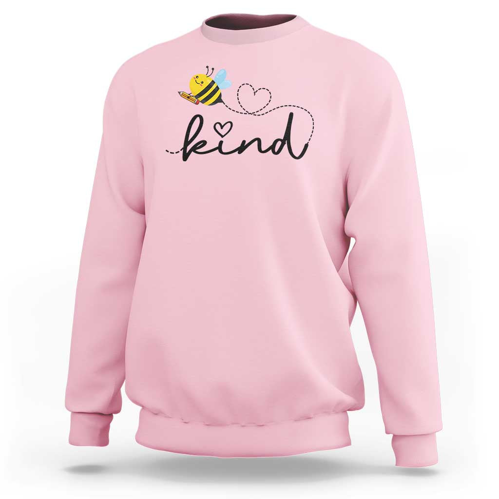 Pink crewneck sweatshirt with bee and heart 'kind' graphic, front view.