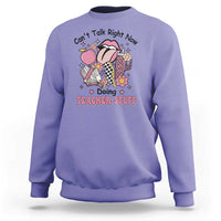 Violet teachers sweatshirt with colorful cartoon graphic and text "Doing TEACHER STUFF"