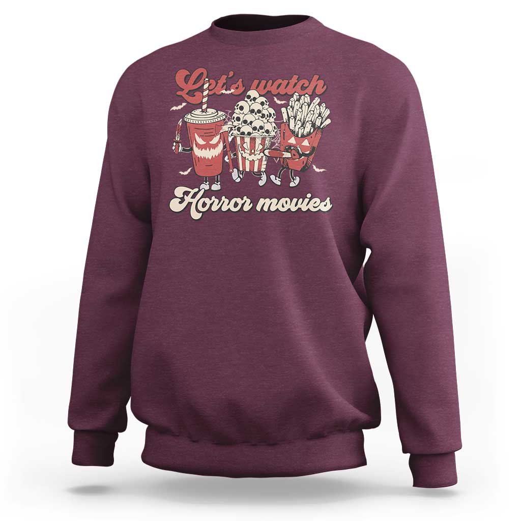 Maroon crewneck sweatshirt with red “Let’s watch Horror movies” graphic on front