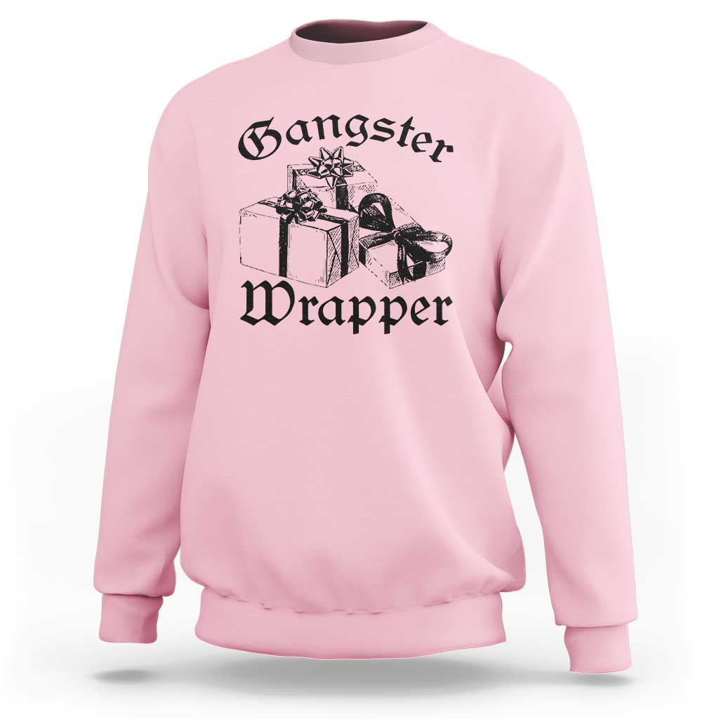 Light pink crewneck Christmas sweatshirt with “Gangster Wrapper” graphic and gift boxes