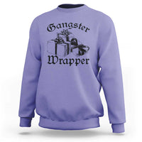 Violet crewneck Christmas sweatshirt with “Gangster Wrapper” graphic and gift boxes