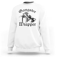 White crewneck Christmas sweatshirt with “Gangster Wrapper” graphic and gift boxes
