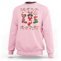 Light pink Christmas sweatshirt with colorful dog owner graphic on front, crew neck