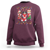 Maroon Christmas sweatshirt with colorful dog owner graphic on front, crew neck
