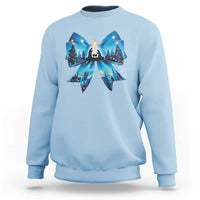Light blue Christmas sweatshirt with blue bow graphic and nativity scene front print