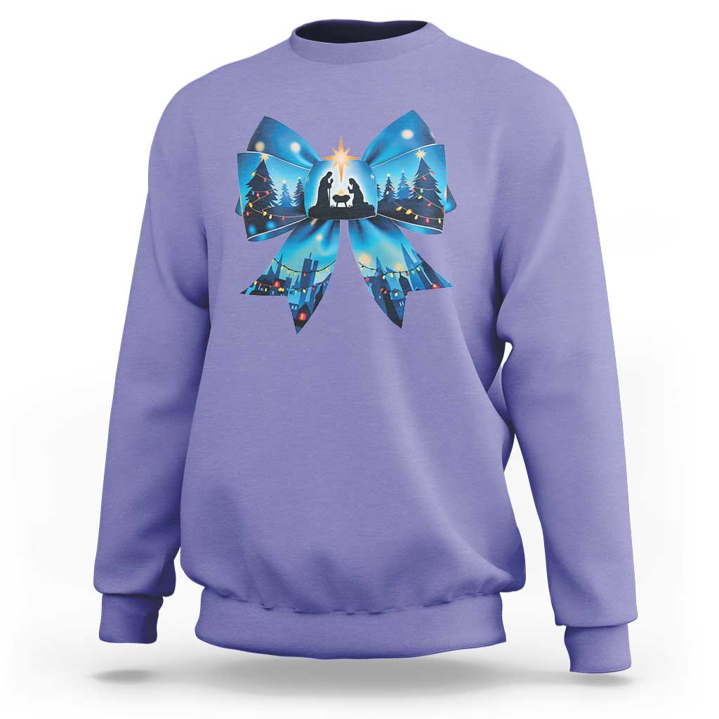 Purple Christmas sweatshirt with blue bow graphic and nativity scene front print