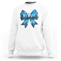 White Christmas sweatshirt with blue bow graphic and nativity scene front print