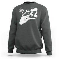 Dark charcoal crewneck sweatshirt with white graphic on the front