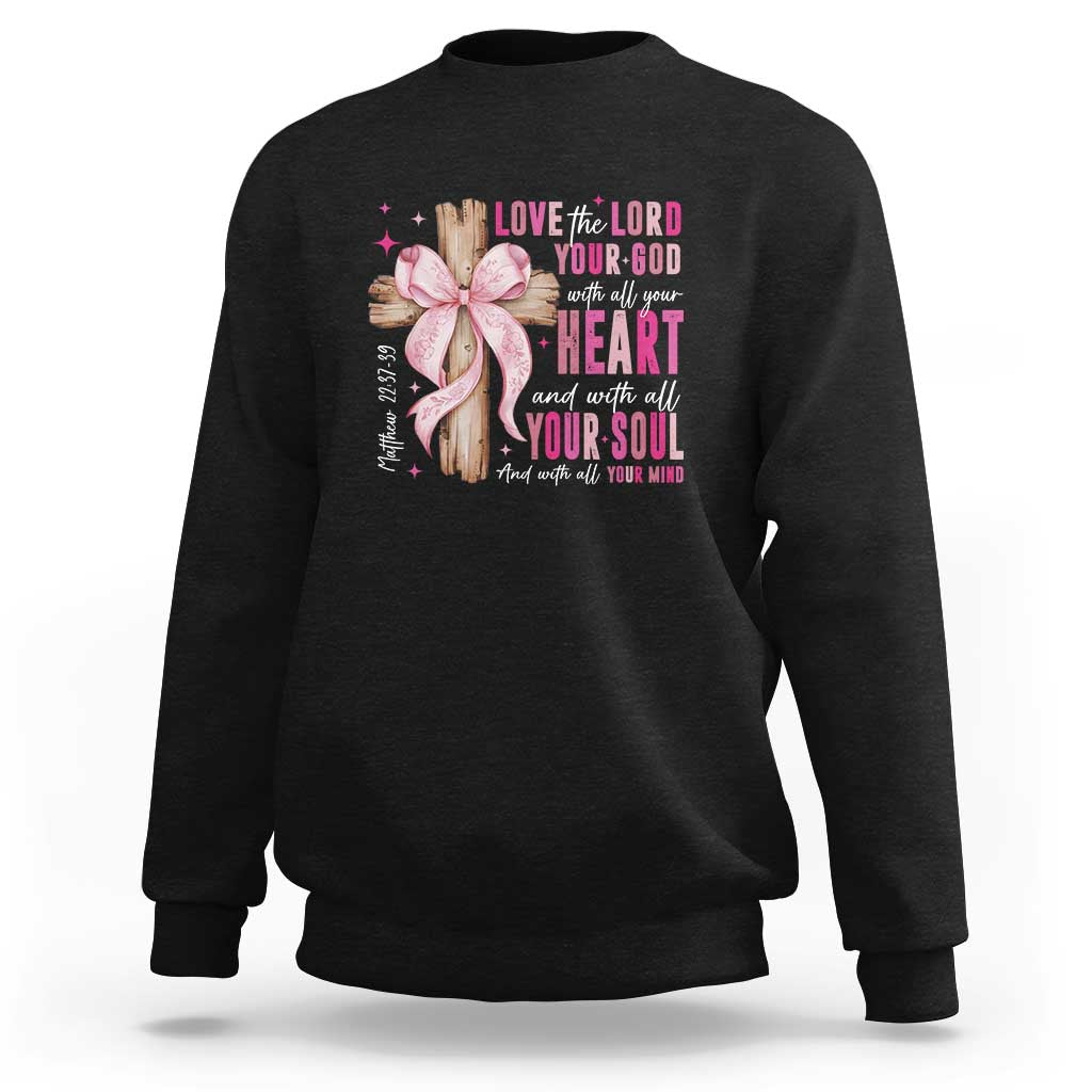 Black crewneck sweatshirt with pink ribbon faith quote graphic on chest