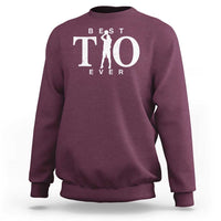 Maroon crewneck sweatshirt with “Best Tio Ever” and basketball figure graphic on chest