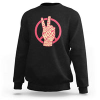Black crewneck sweatshirt with red peace-sign graphic and Harris 2024 text.