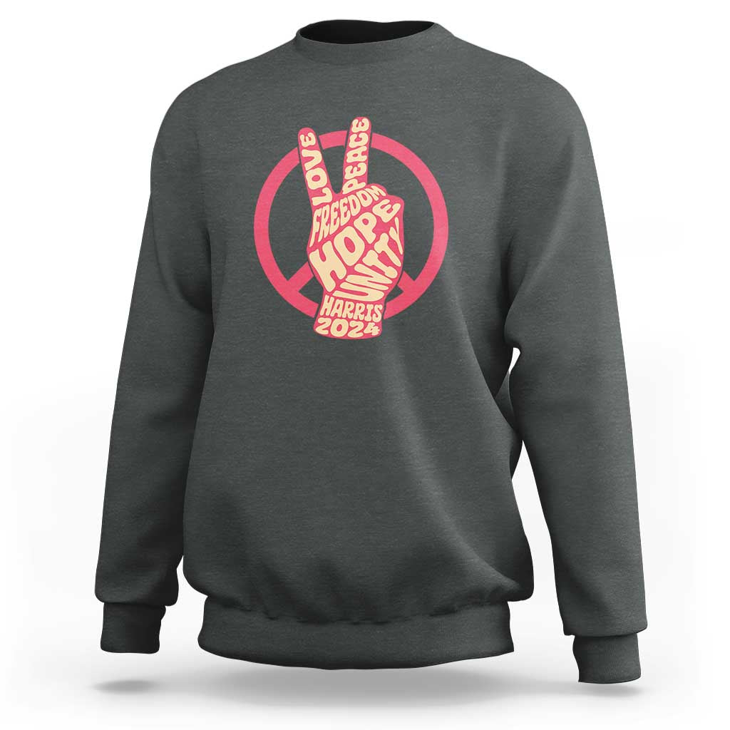 Charcoal gray crewneck sweatshirt with red peace-sign graphic and Harris 2024 text.