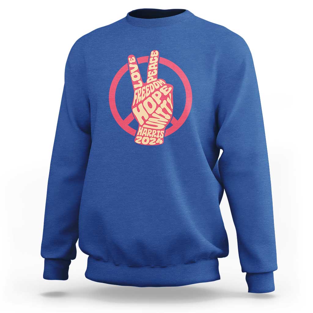 Blue crewneck sweatshirt with red peace-sign graphic and Harris 2024 text.