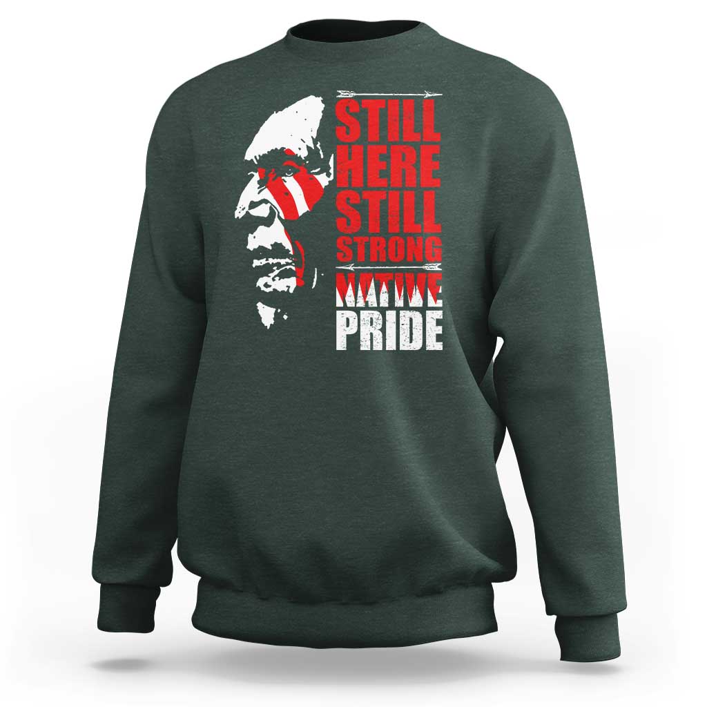Dark green crewneck sweatshirt with Native-inspired profile graphic and red stacked text front