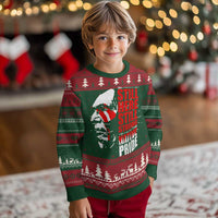 Kids' ugly Christmas sweater with Native-style graphic, trees, and stripes in green and red