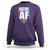 Purple crewneck sweatshirt with centered Native-inspired graphic print and ribbed cuffs