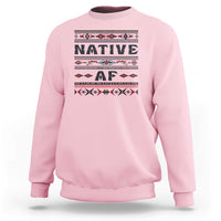 Light pink crewneck sweatshirt with bold 'Native AF' geometric tribal graphic
