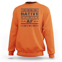 Orange crewneck sweatshirt with bold 'Native AF' geometric tribal graphic
