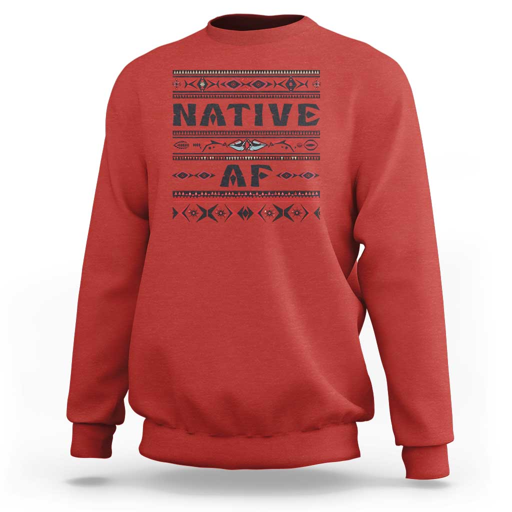 Red crewneck sweatshirt with bold 'Native AF' geometric tribal graphic